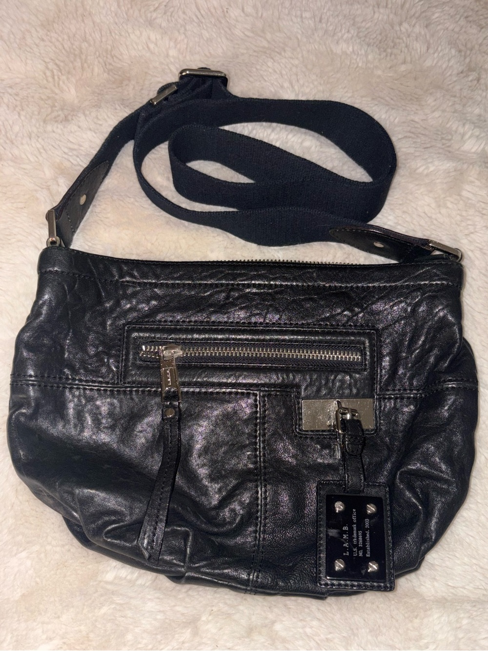 L.A.M.B. Black Leather Crossbody with Front Zip and Logo Plate